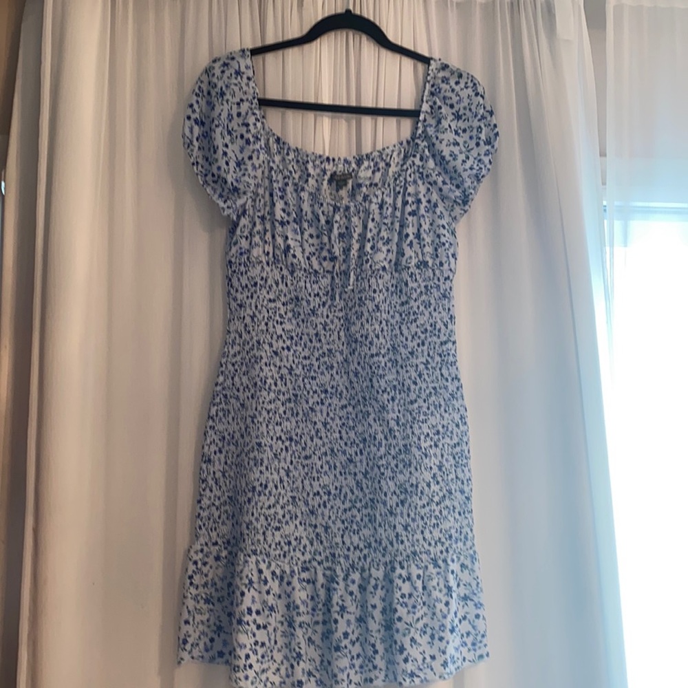 Brand new never worn Light blue Dress with blue flowers and ruched center